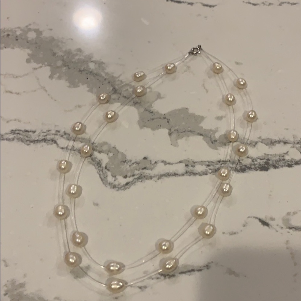 Floating pearl necklace